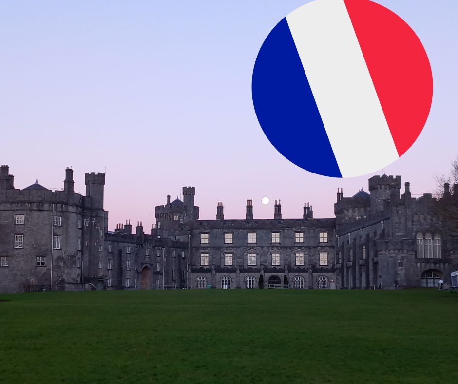 View of Kilkenny Castle from the park with a Frecnh flag